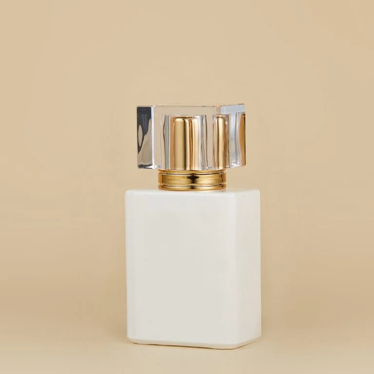 White Perfume Bottle with Clear Gold-Accent Cap